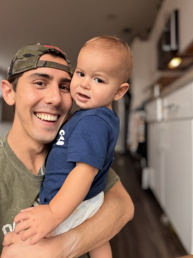 Tyler holding his son Cal